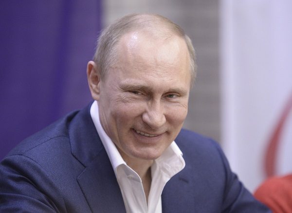 russian-president-vladimir-putin-smiles-as-he-celebrates-international-womens-day-in-sochi